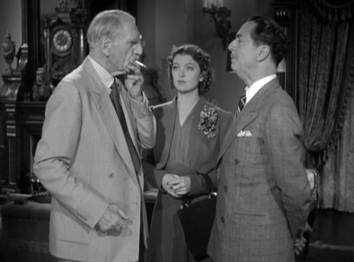 The Colonel (C. Aubrey Smith) explains why he thinks someone is trying to murder him to Nick and Nora Charles (William Powell, Myrna Loy).