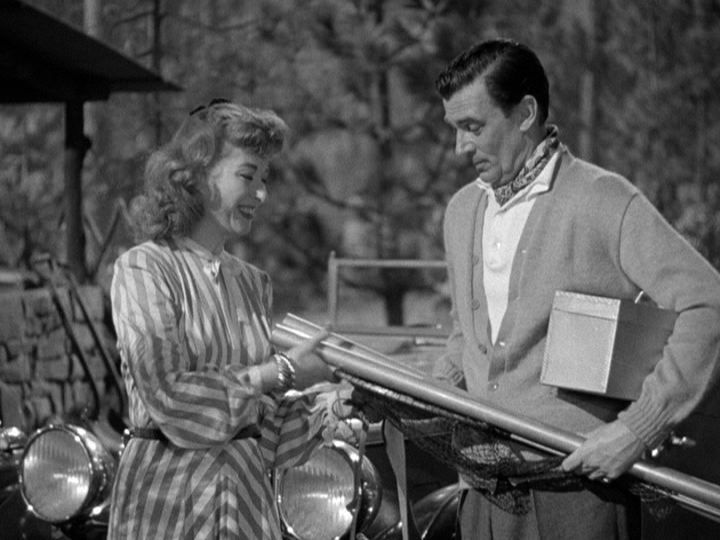 Greer Garson and Walter Pidgeon prepare to go fishing in Julia Misbehaves.