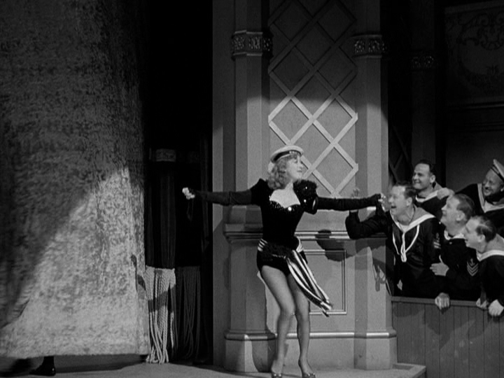 Greer Garson sings a special song for several servicemen