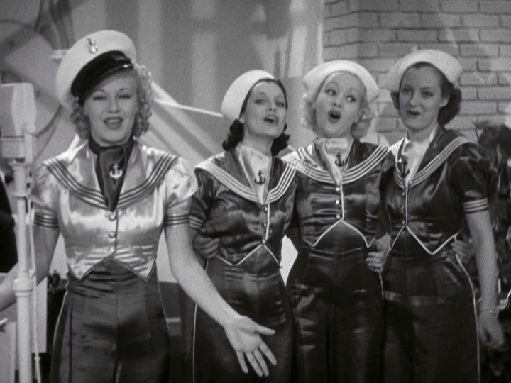 Ginger Rogers and three female backup singers put on a show for incoming sailors.