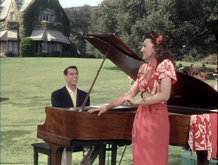 Cole Porter (Cary Grant) rehearses with one of the stars of his latest musical (Ginny Simms).