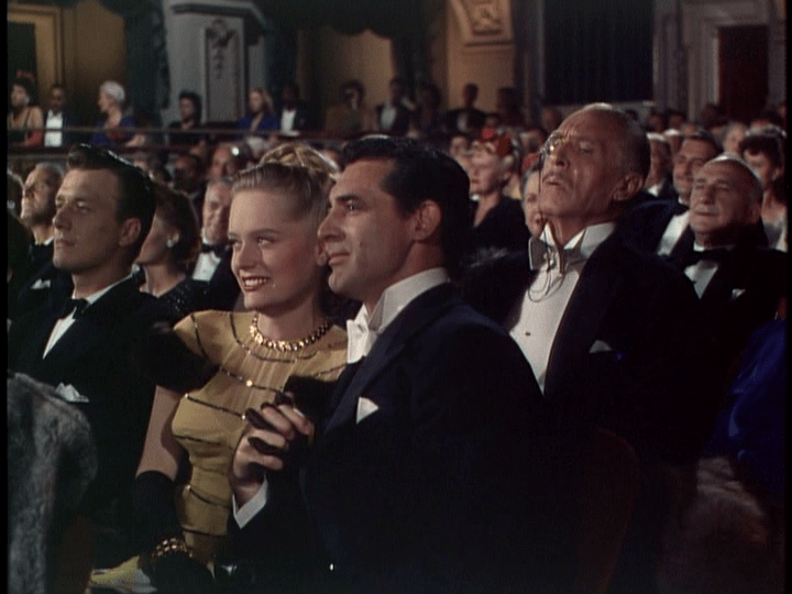 Alexis Smith and Cary Grant enjoy an evening of Cole Porter music.