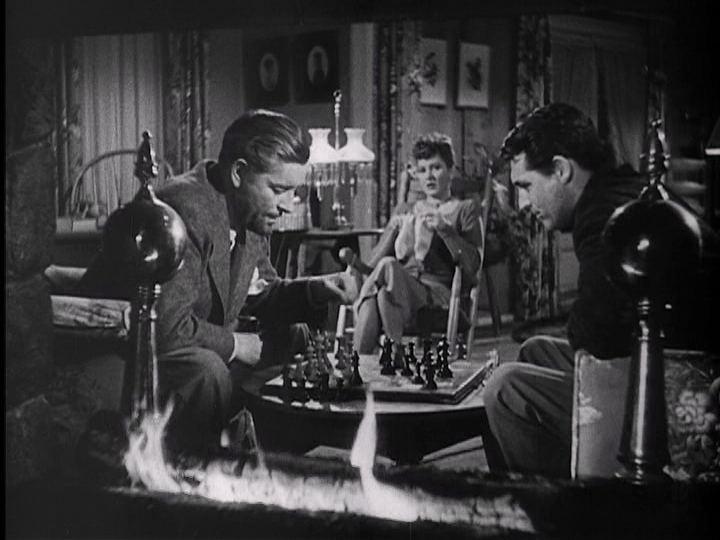 Ronald Colman, Jean Arthur, and Cary Grant enjoy a quiet evening of chess and knitting in "The Talk of the Town."