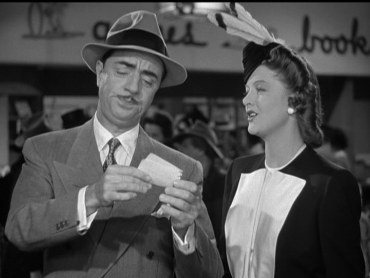 William Powell, Myrna Loy after he takes a dizzying spin on a merry-go-round.