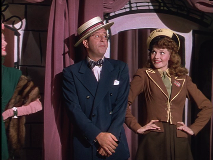 Phil Silvers, Rita Hayworth share a dance number in Cover Girl.