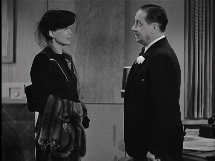 Frieda Inescort and Robert Benchley discuss the tenuous state of their marriage in "You'll Never Get Rich."